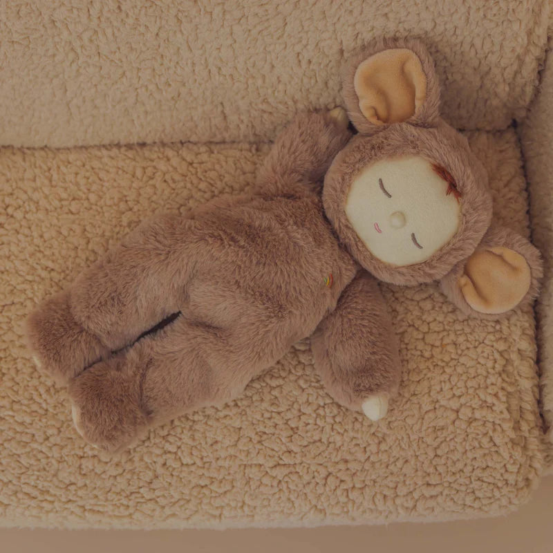 Brown mouse plush toy on a soft white surface