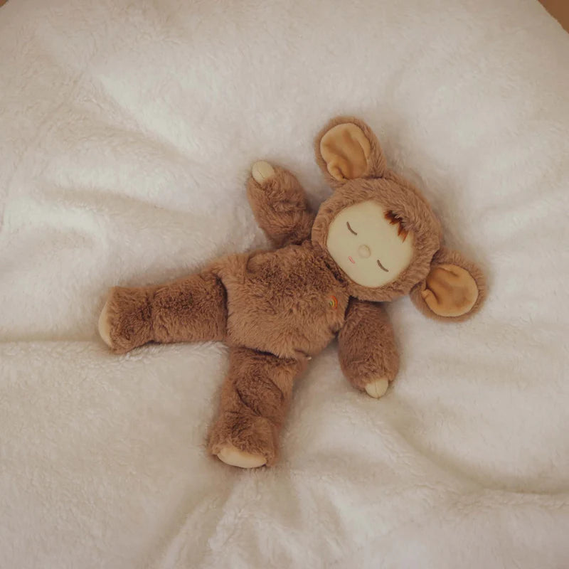 Brown mouse plush toy on a soft white surface