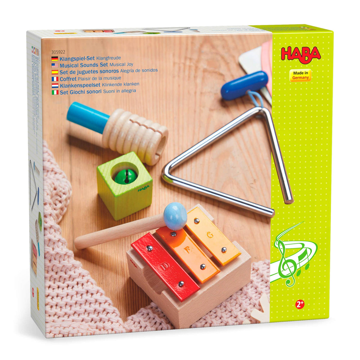 HABA musical toy set packaging with colorful instruments on a wooden surface