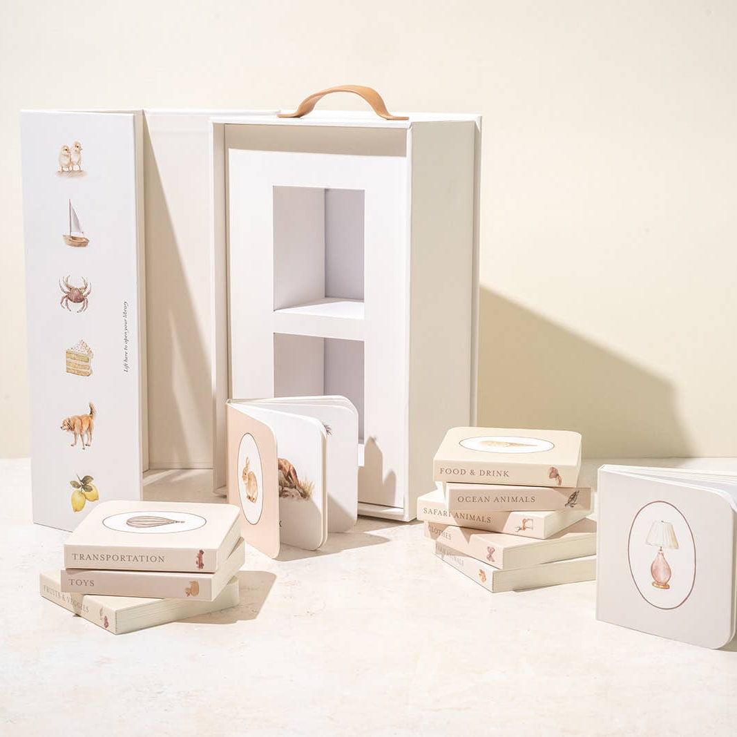 Set of books and packaging on a light surface with a neutral background