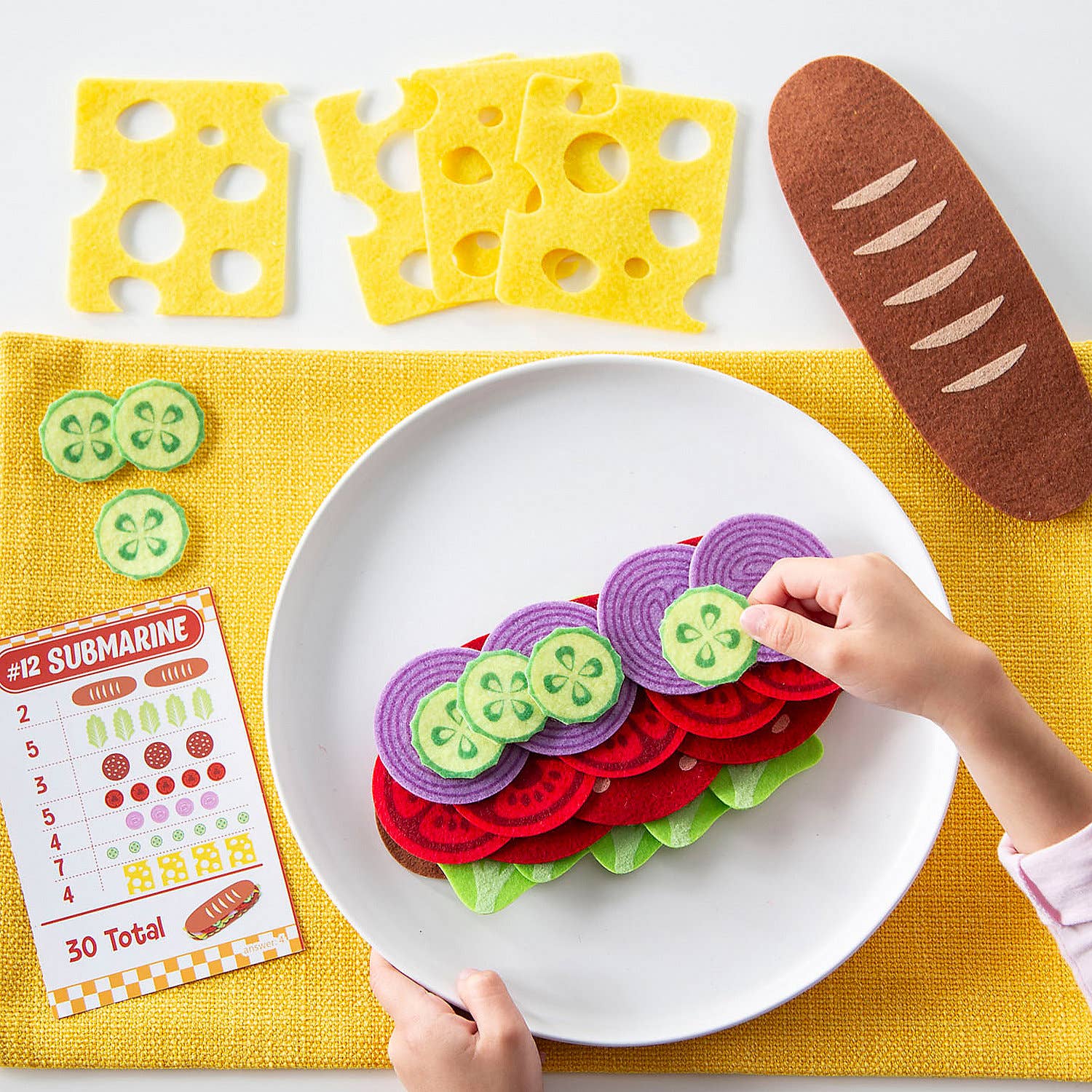 Math Sandwich educational toy set on a kitchen counter with a book titled 'Math Sandwich'.