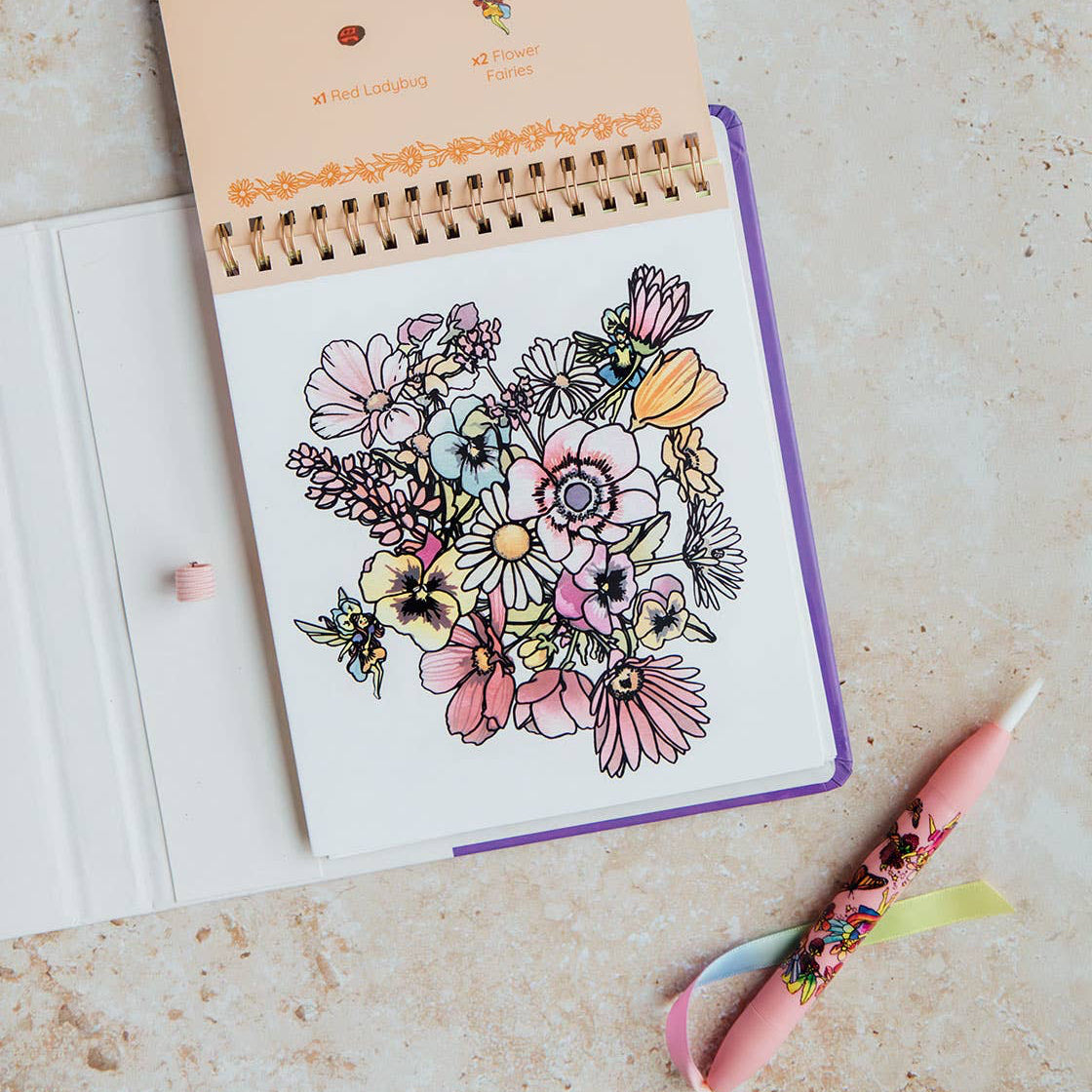 Open notebook with floral design on a textured surface