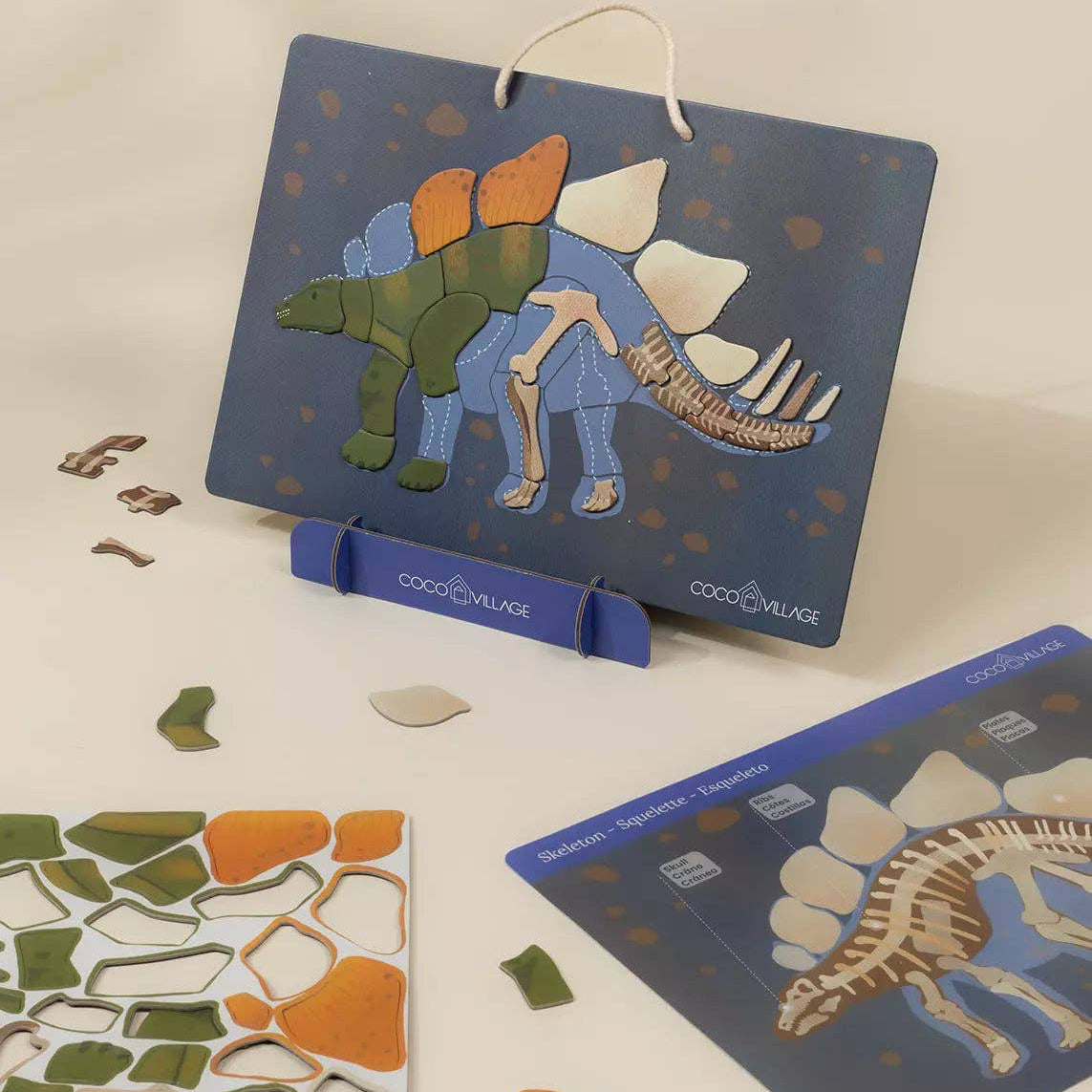 Children's dinosaur puzzle with pieces on a light background