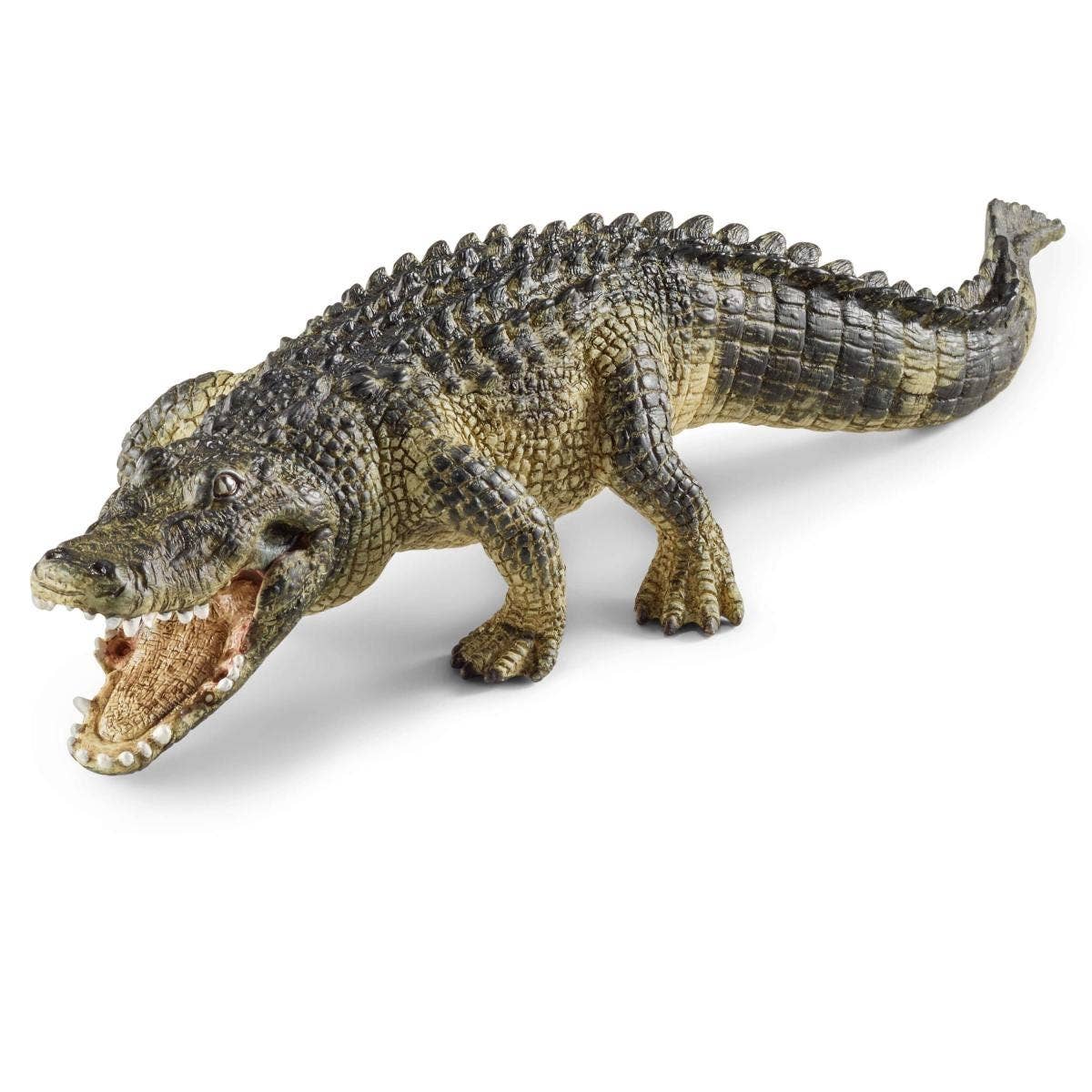 Toy crocodile figure on a white background