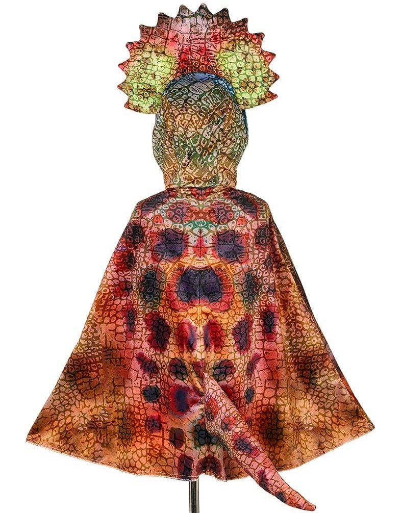 Colorful costume with a matching headpiece on a mannequin against a white background