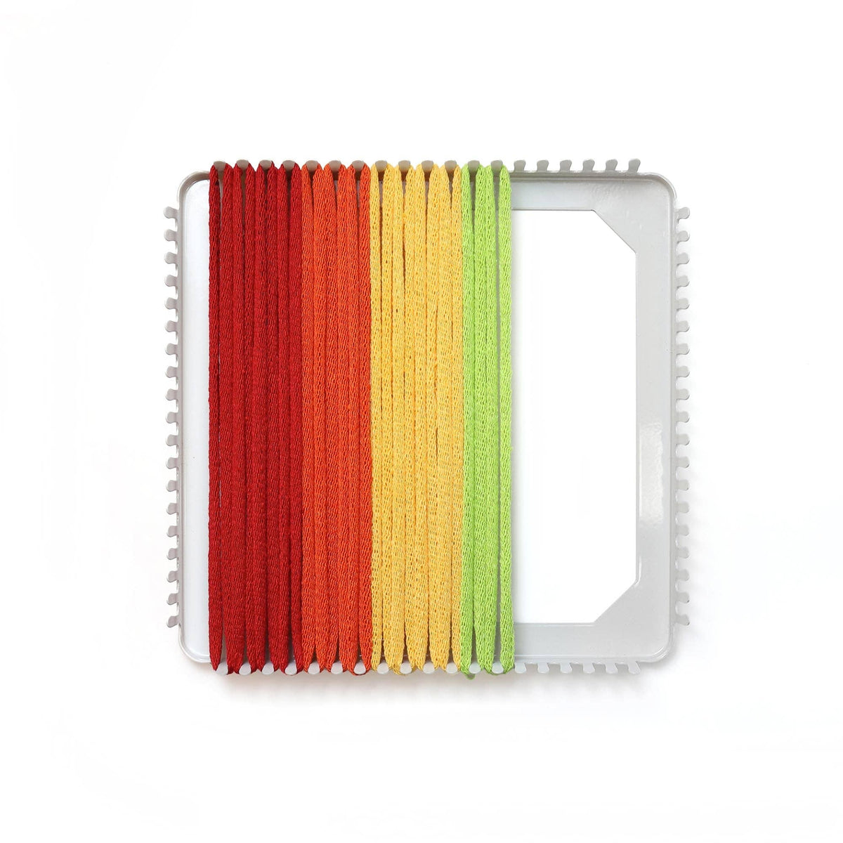 Loom material with red, orange, yellow, and green yarn on a white background
