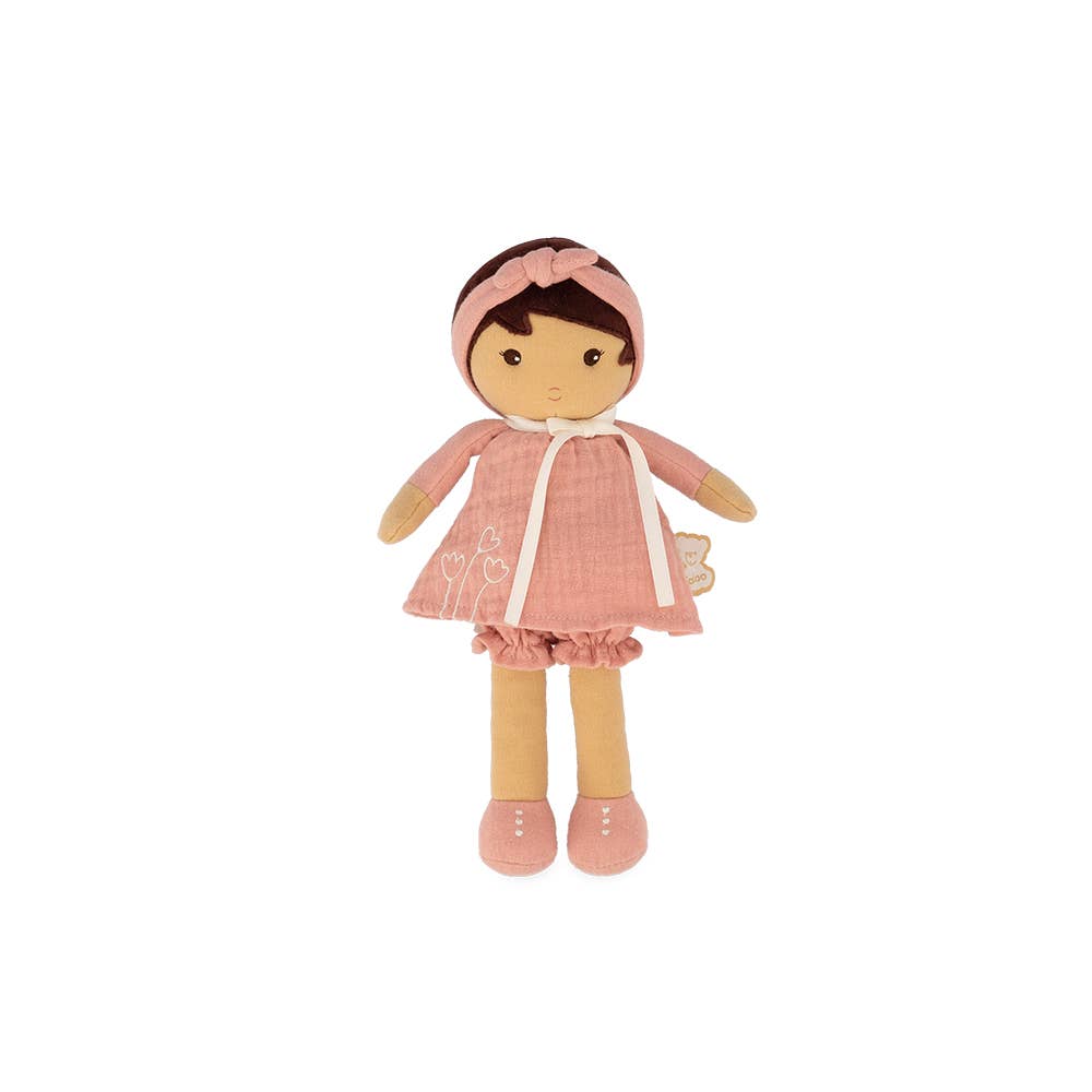 Plush doll in a pink outfit with a matching headband on a white background