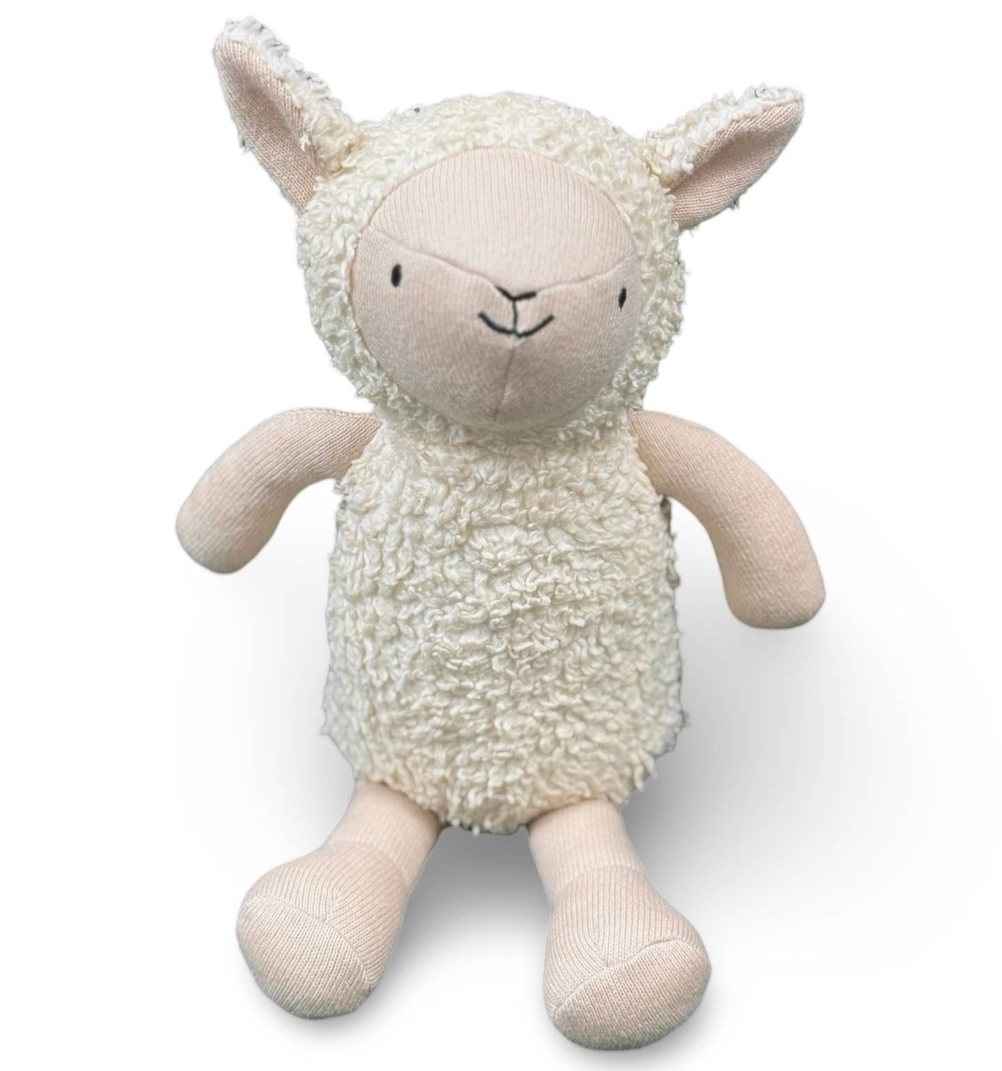 Stuffed toy sheep on a white background