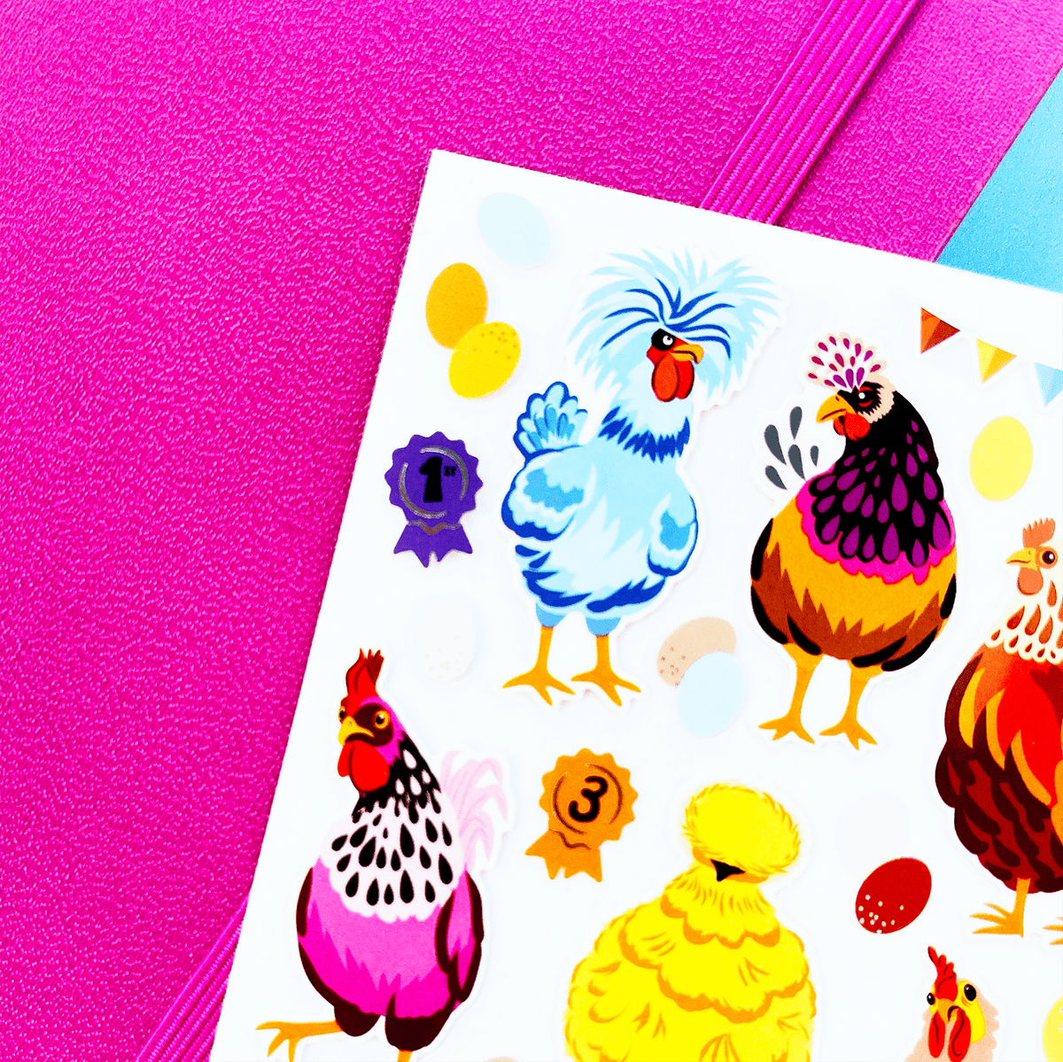 Colorful chicken and rooster stickers on a pink and blue background