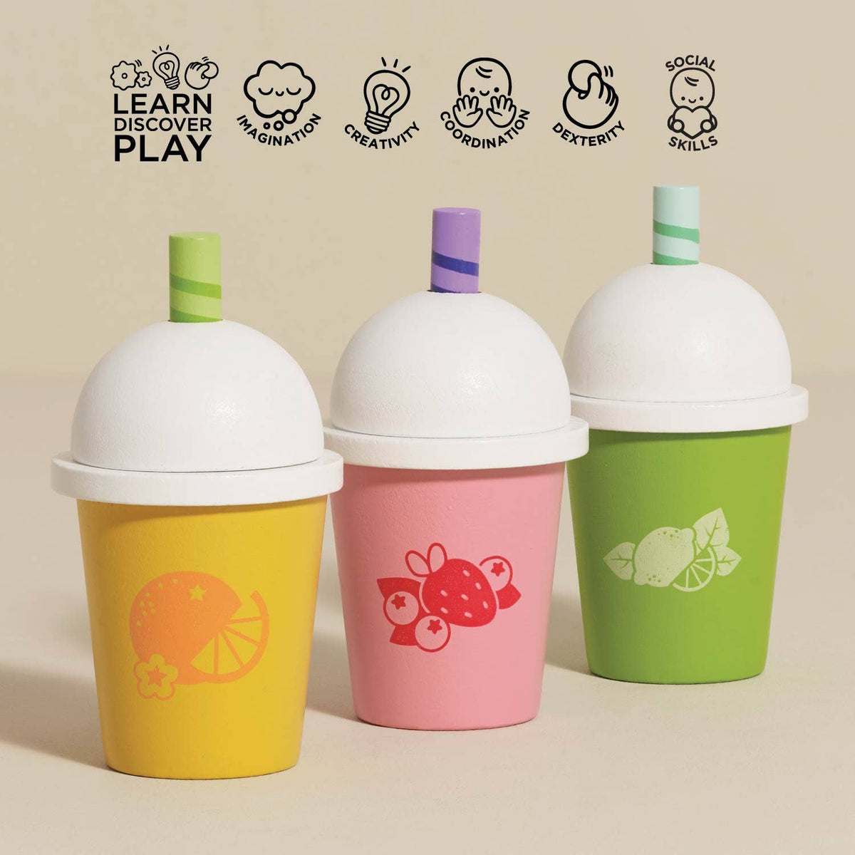 Three colorful cups with lids and straws on a beige background, featuring icons and text about learning, discovery, and play.