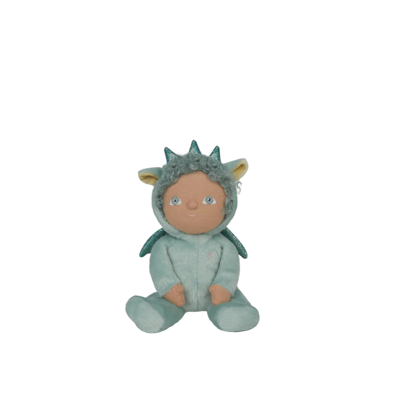 Soft toy dragon in a green outfit with star decorations on the wall.