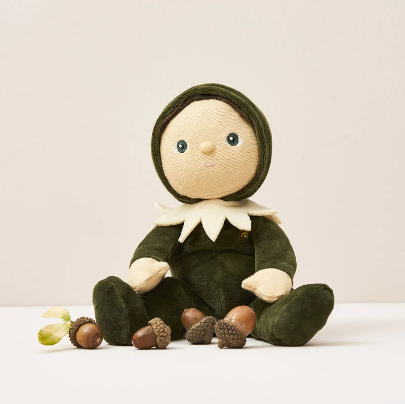 Stuffed toy dressed in green with acorns on a light background