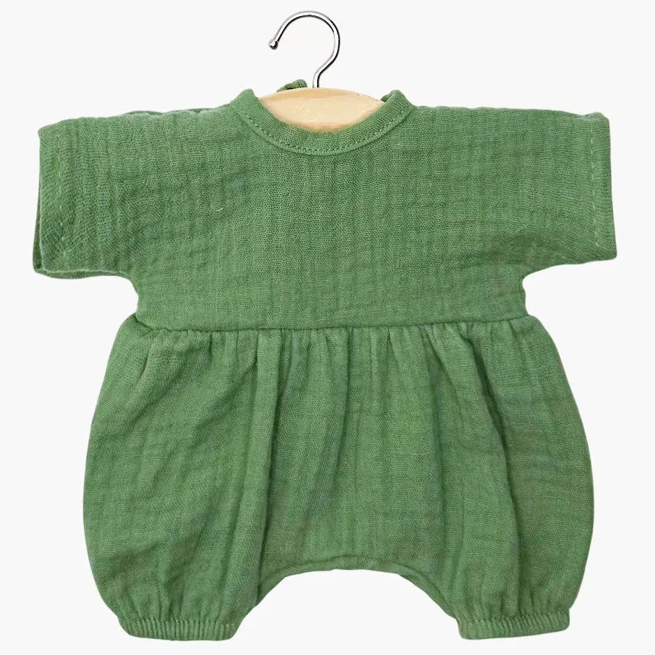 Green baby doll romper on a hanger against a white background