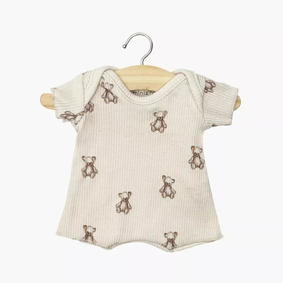 Baby romper with teddy bear pattern on a hanger against a white background