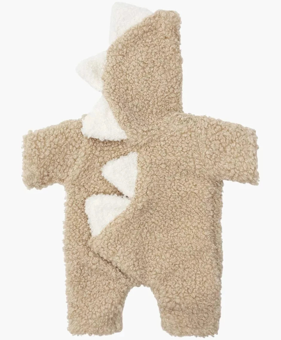 Beige baby onesie with white accents on a white background