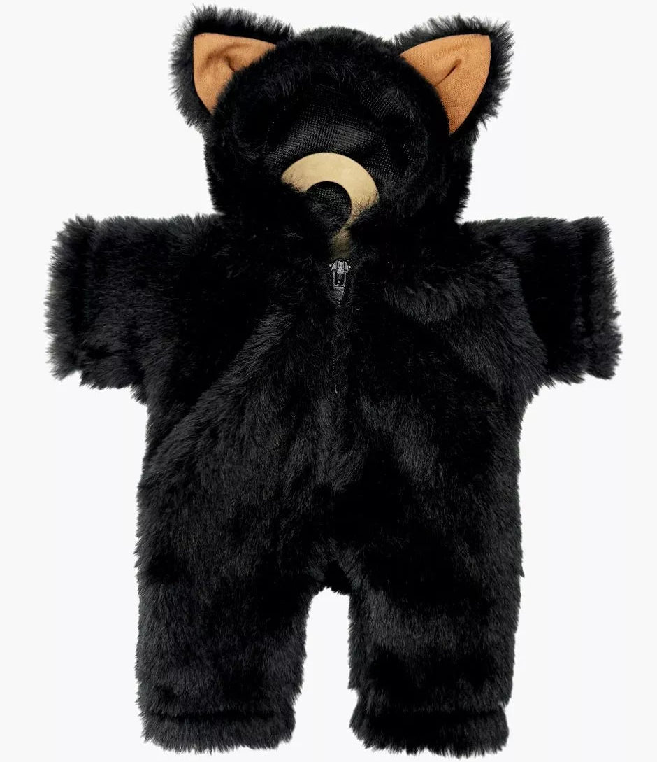 Doll wearing a black fluffy cat costume on a white background