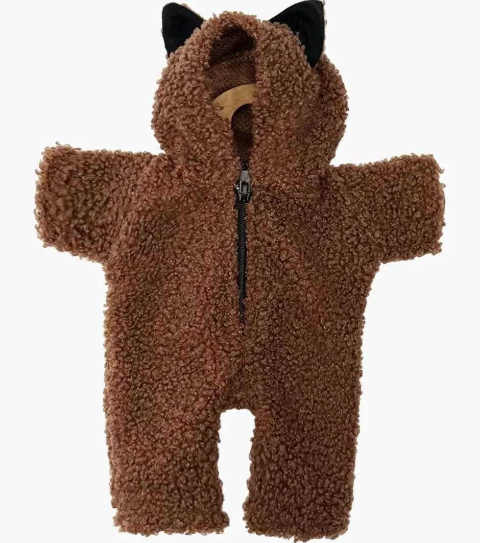 Brown fuzzy baby doll onesie with black ears on a white background