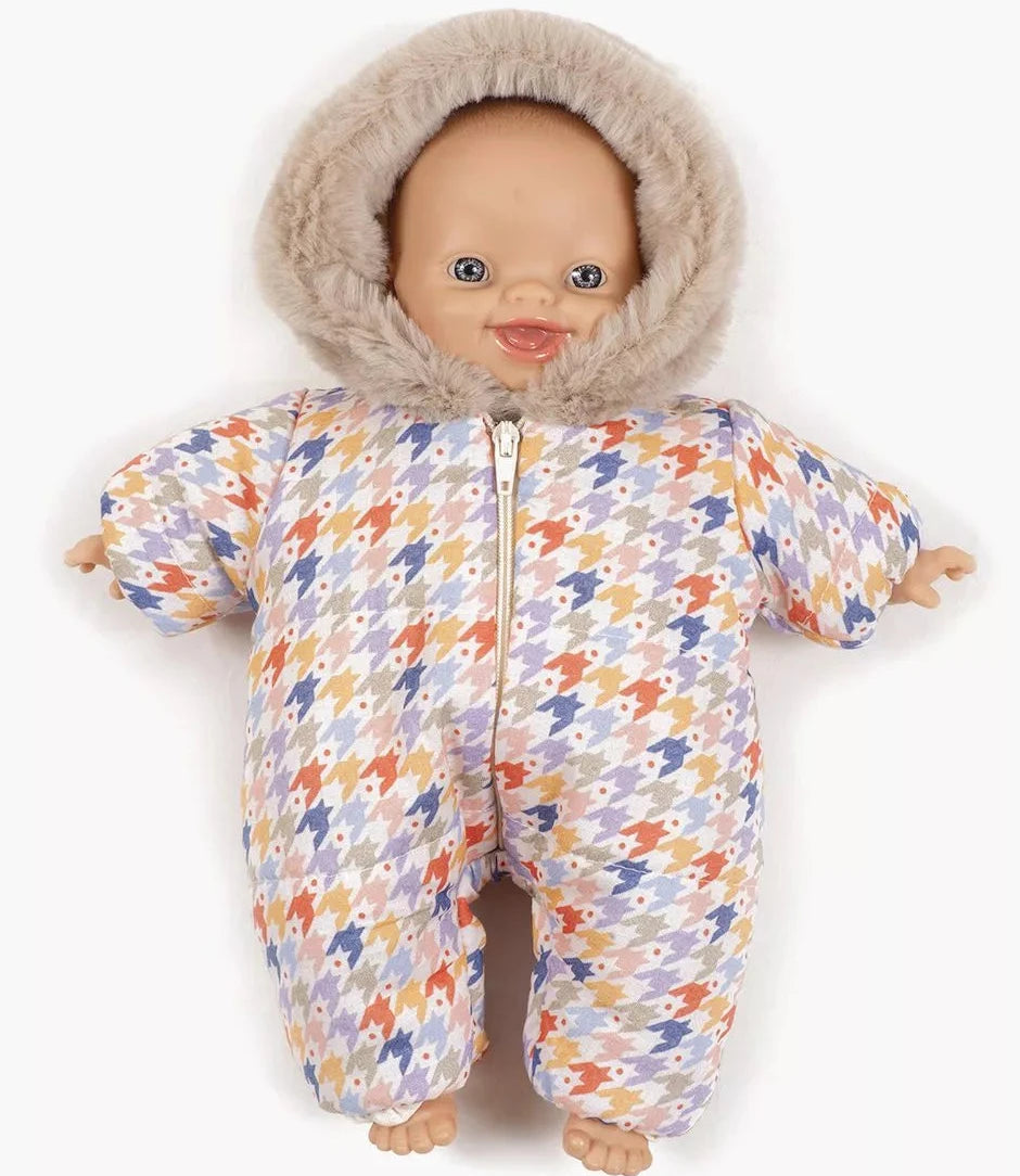 Baby doll wearing a colorful snowsuit with a fur-lined hood on a white background