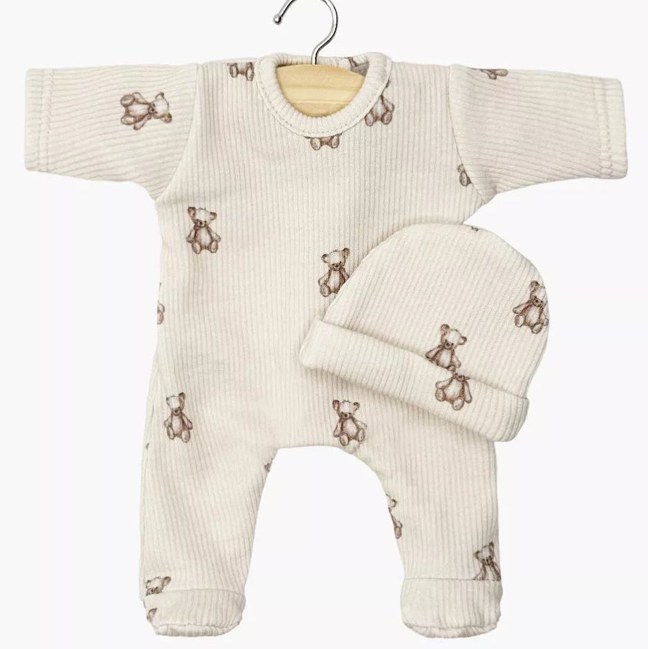 Baby doll outfit with onesie and hat on a hanger against a white background