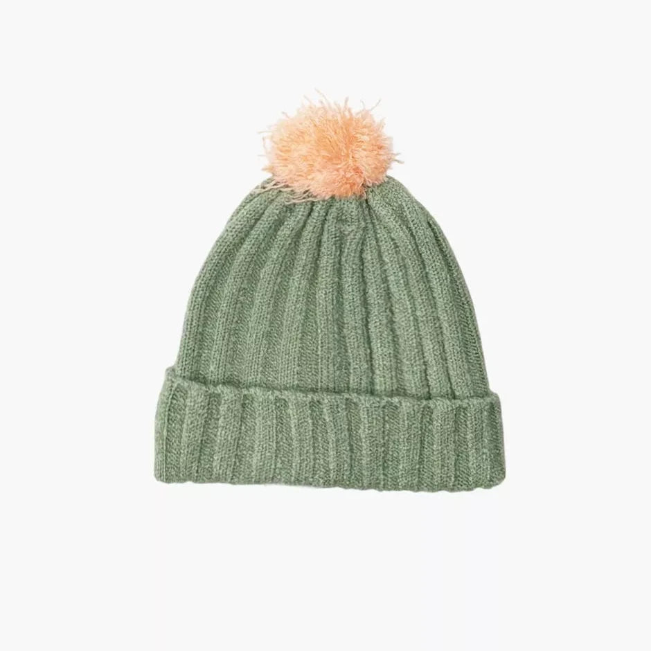 Green knit doll beanie with a pink pom-pom on a white background