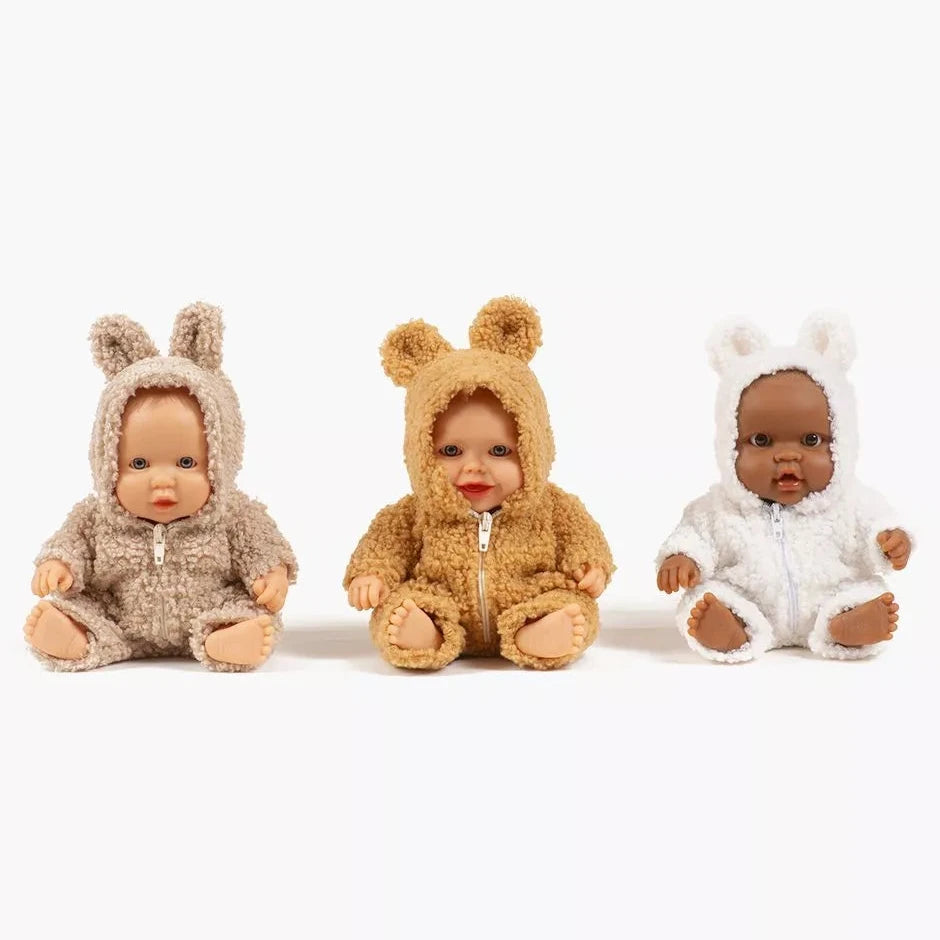Three dolls wearing animal-themed outfits on a white background