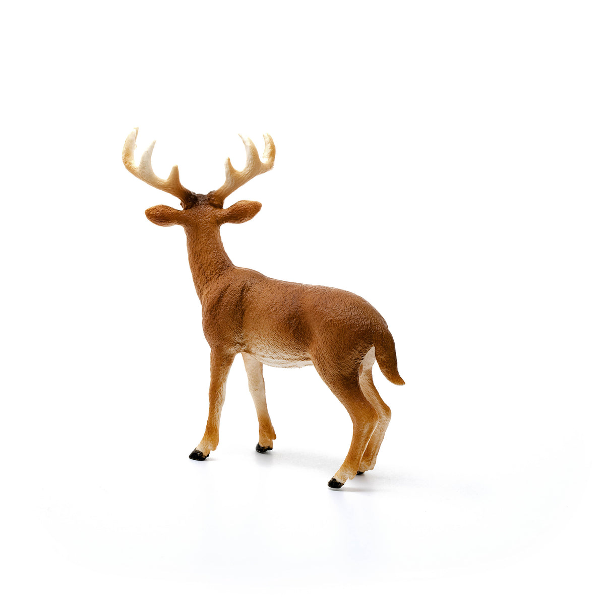 Deer figurine on a white background