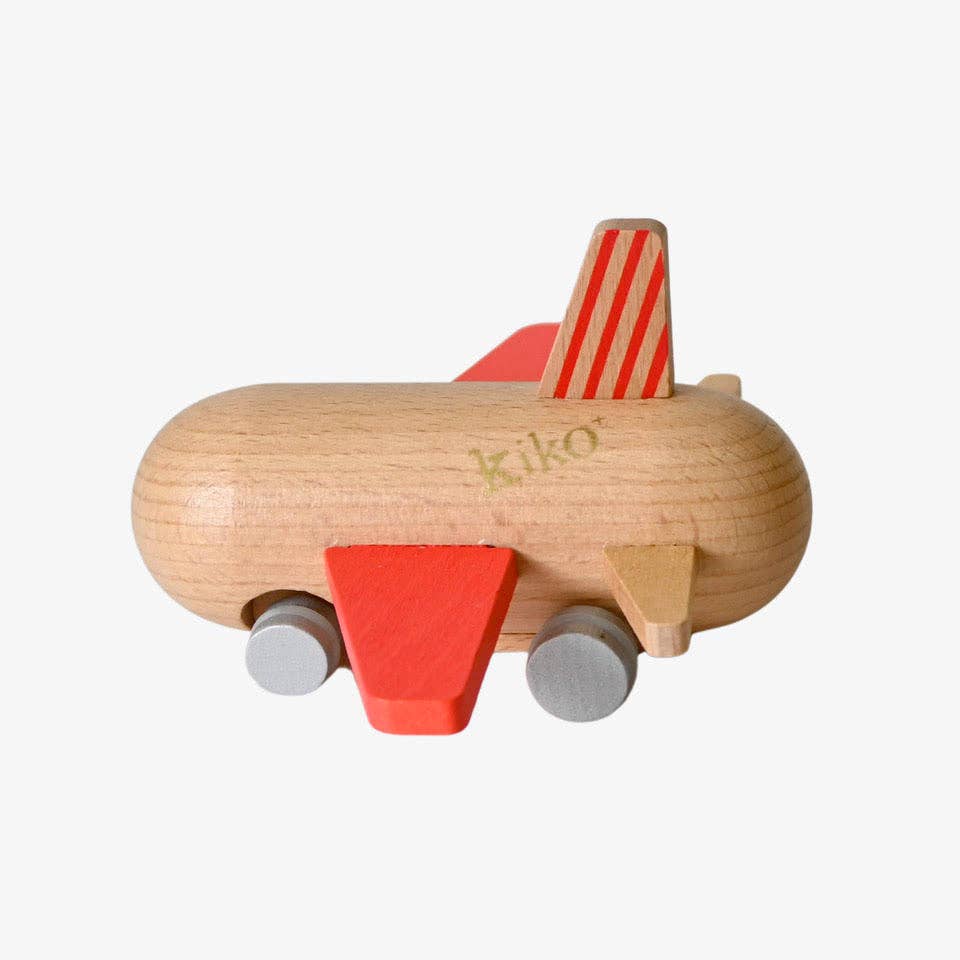 Two wooden toy cars with striped flags on a beige surface
