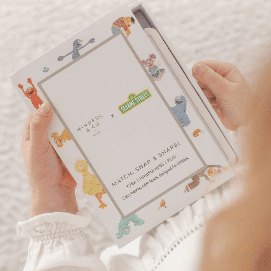 Children's activity book with Sesame Street characters on a white background