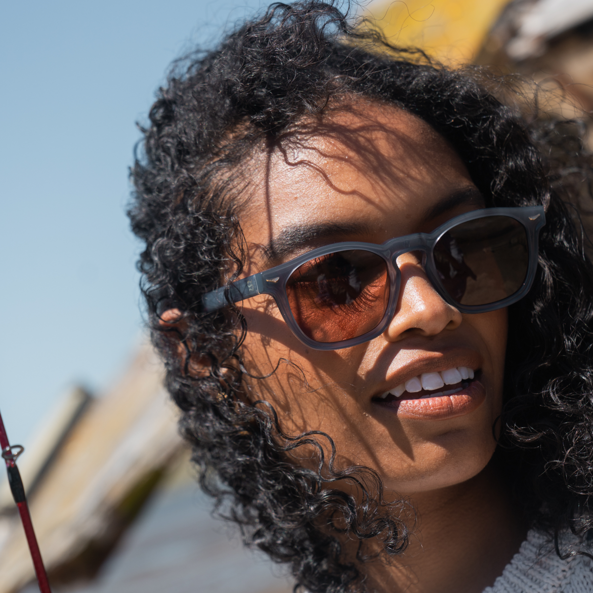 Woman wearing sunglasses with a blurred natural background