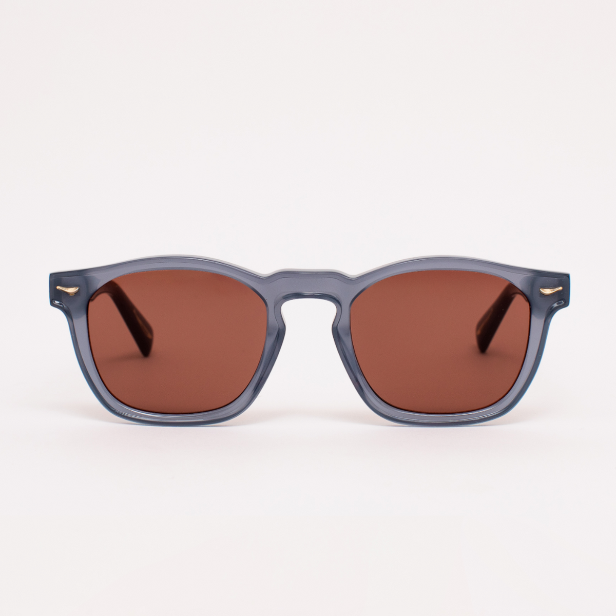 Sunglasses with brown lenses and gray frames on a white background