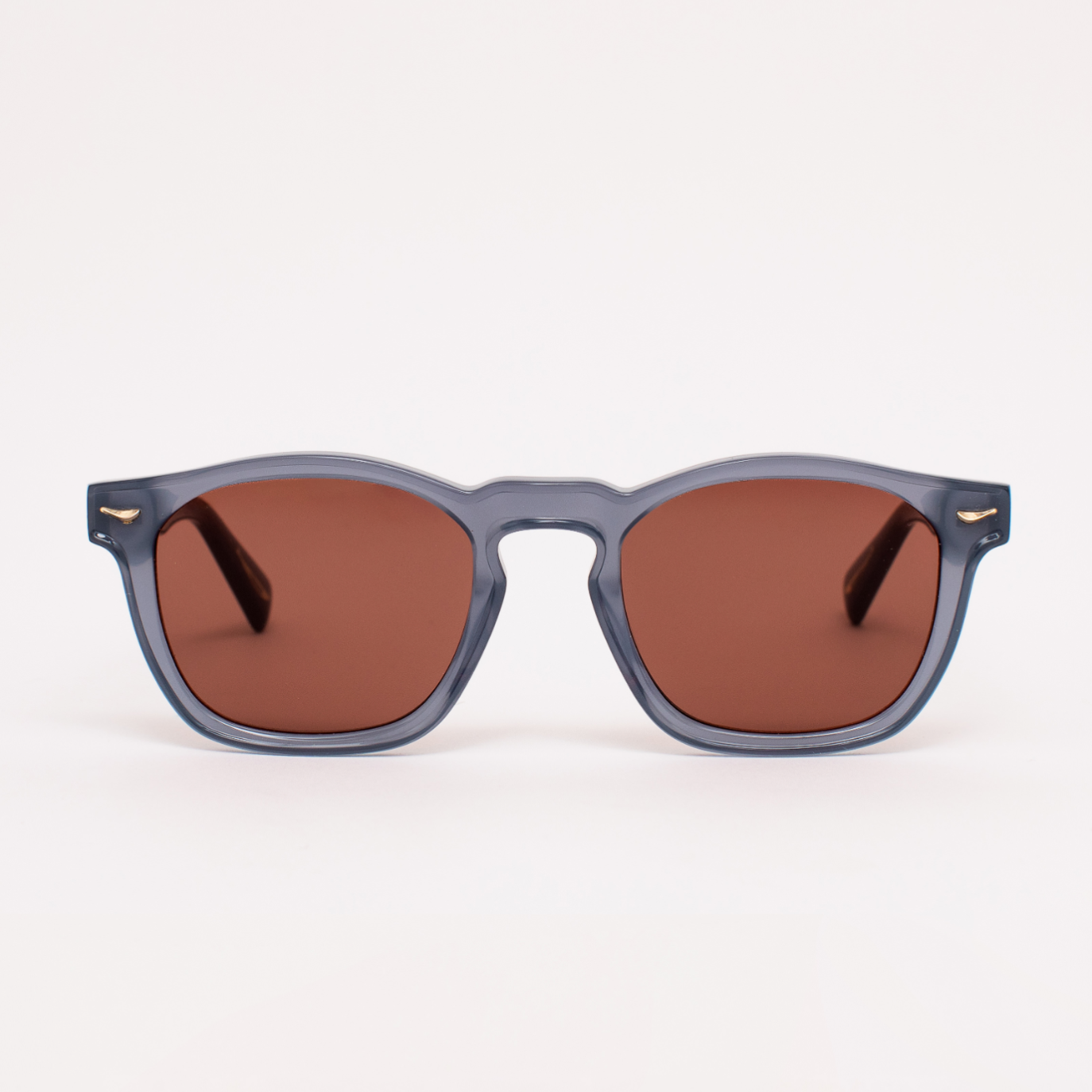 Sunglasses with brown lenses and gray frames on a white background
