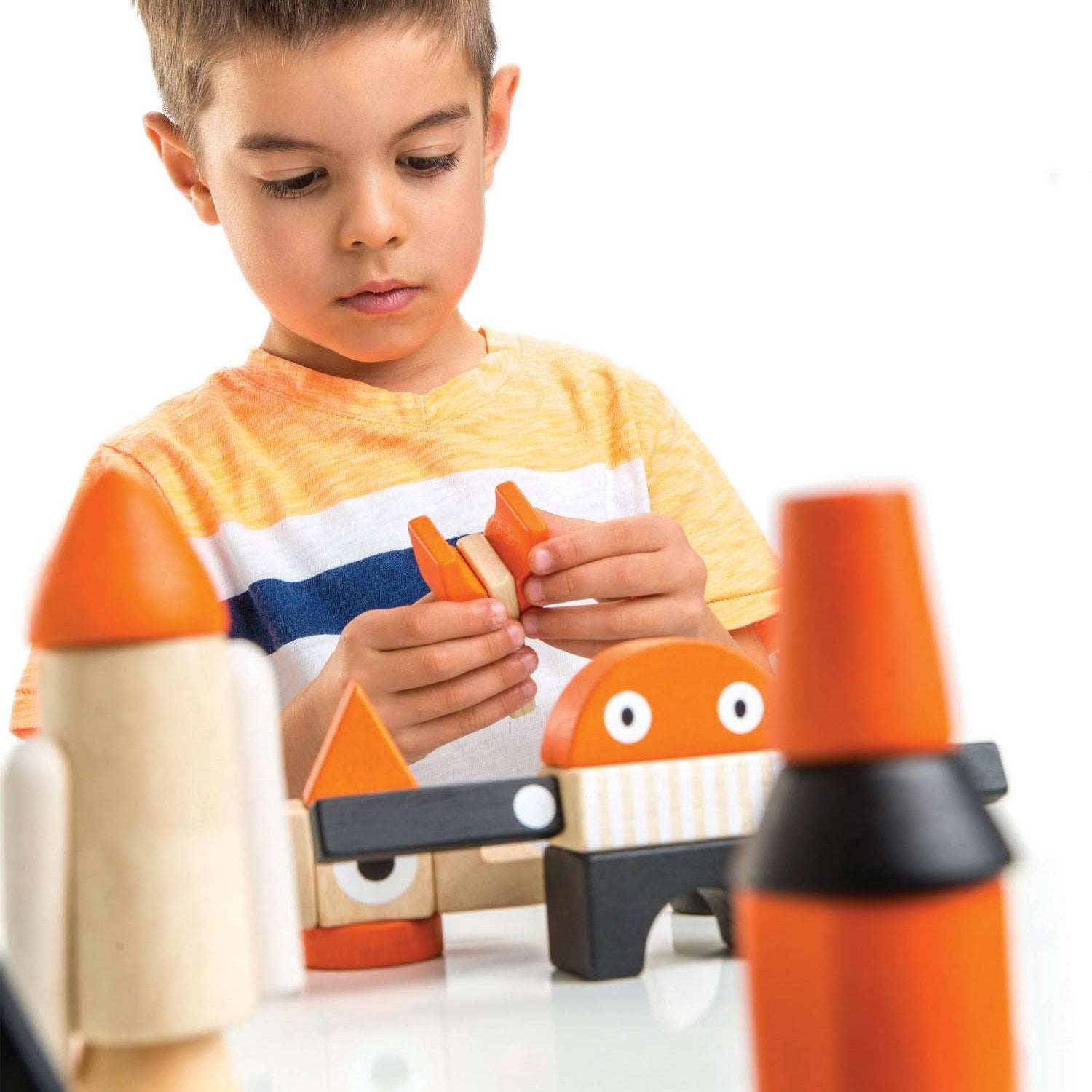 Wooden toy rocket and space shuttle on a white background