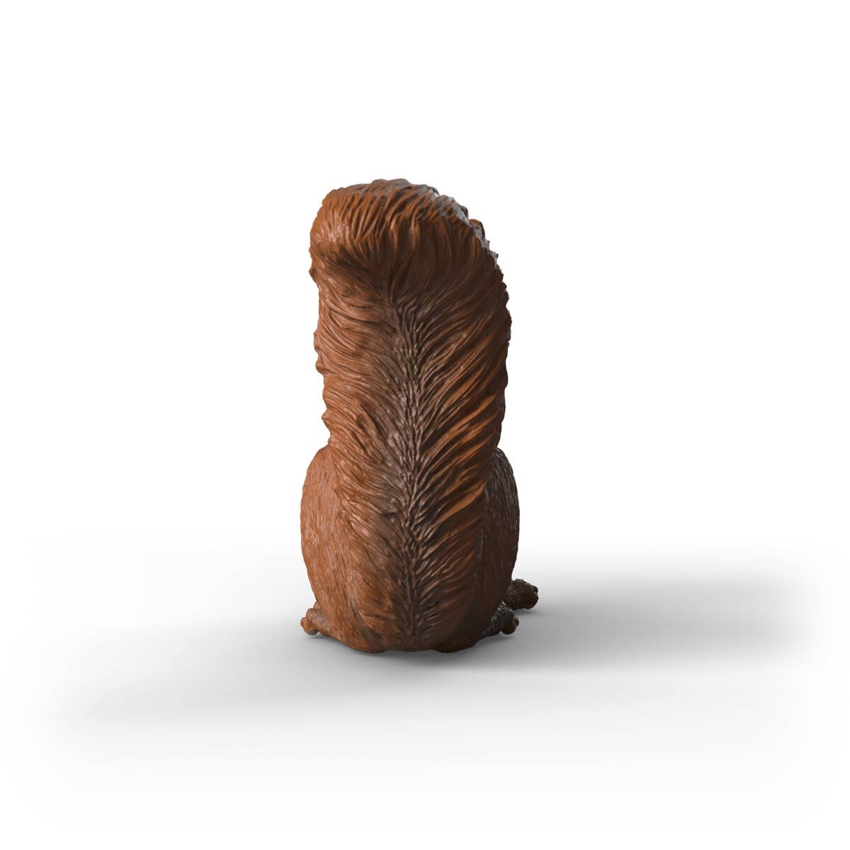 Brown squirrel figurine on a white background
