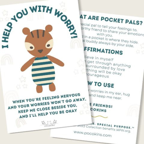 A printed card with a cartoon bear wearing a striped shirt, shown alongside another card with text about pocket friends and affirmations on a light beige background.