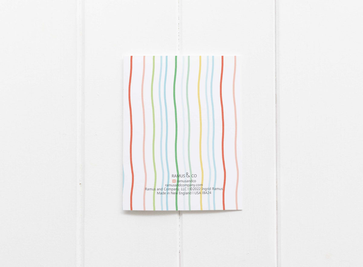 Notebook with colorful striped design on a white background
