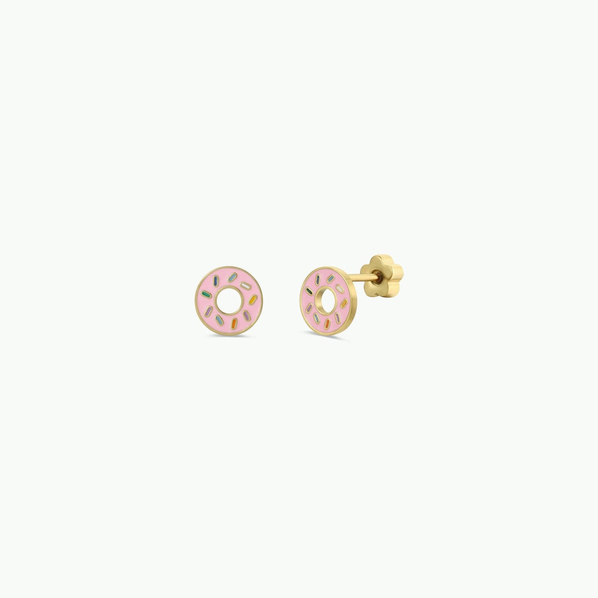 Pair of pink donut-shaped earrings on a white background