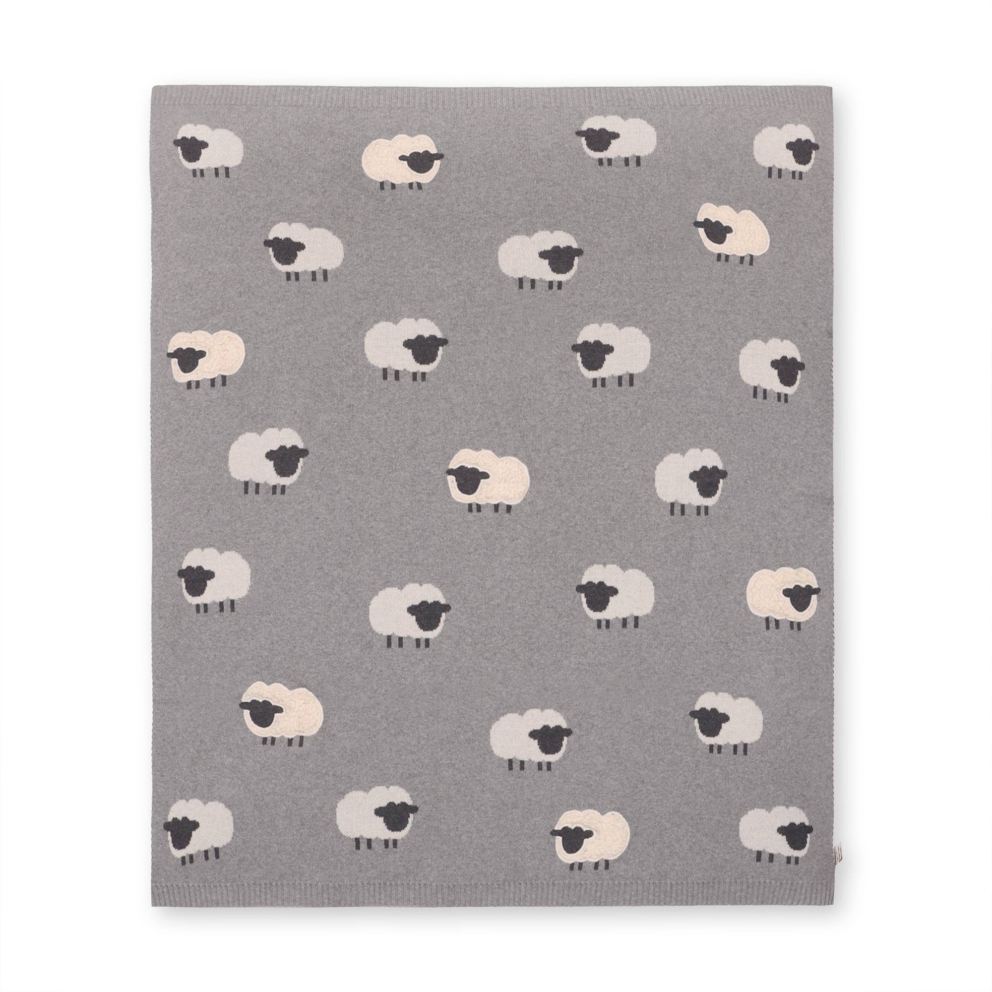 Gray knitted blanket with sheep designs on a white background