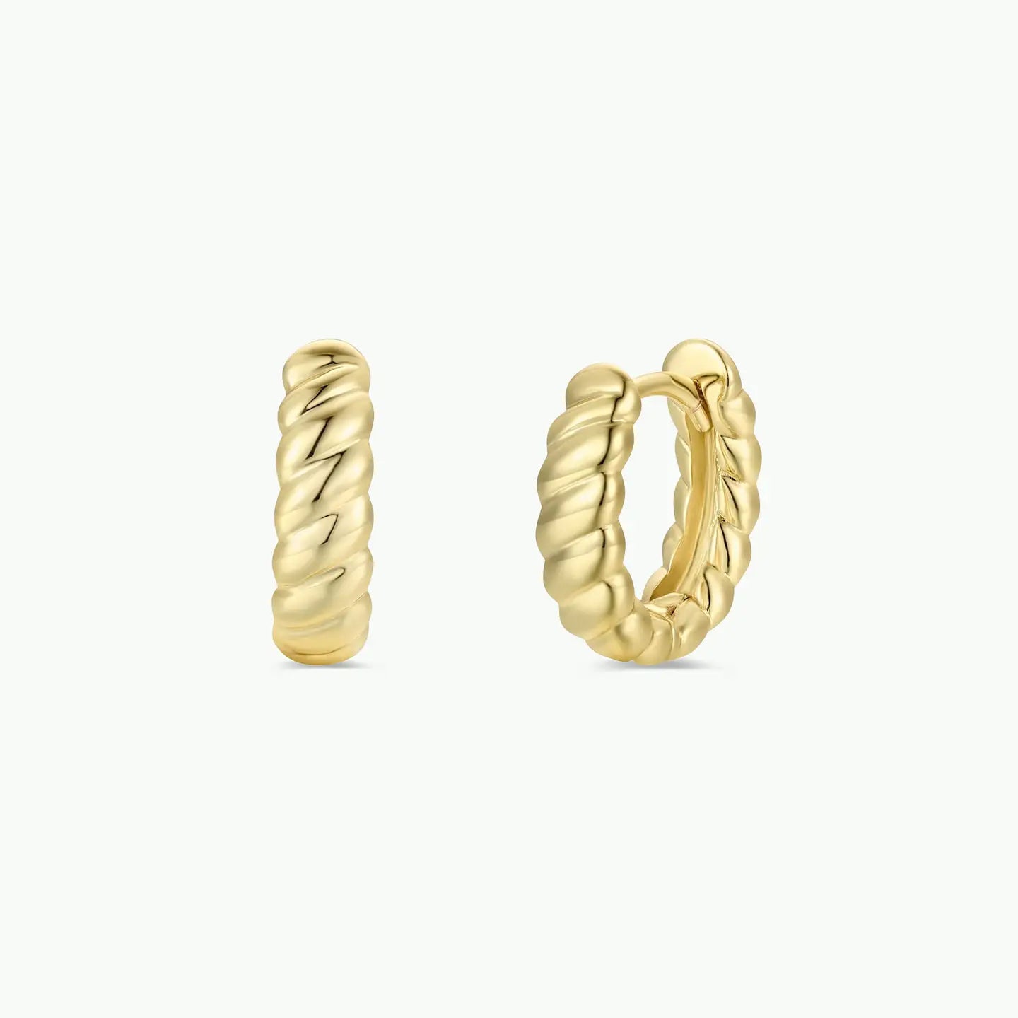 Gold hoop earrings on a white background