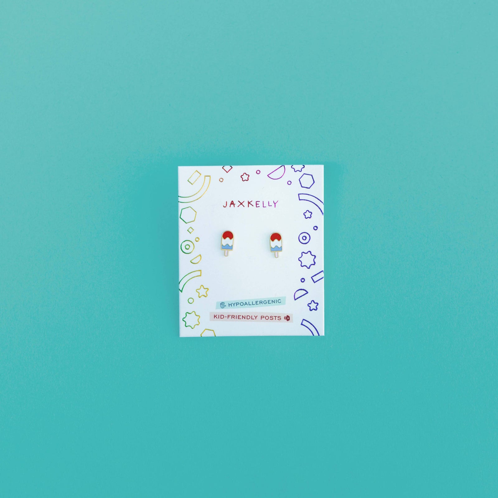 Jankelly earrings packaging on a teal background