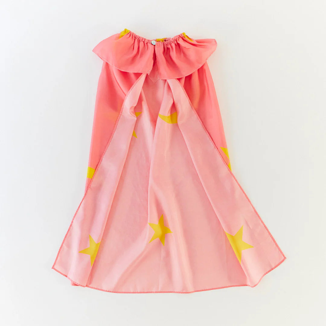 Pink cape with yellow star patterns on a white background
