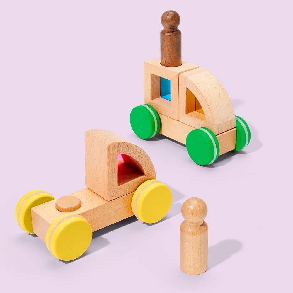 Two wooden toy cars with green and yellow wheels on a light purple background