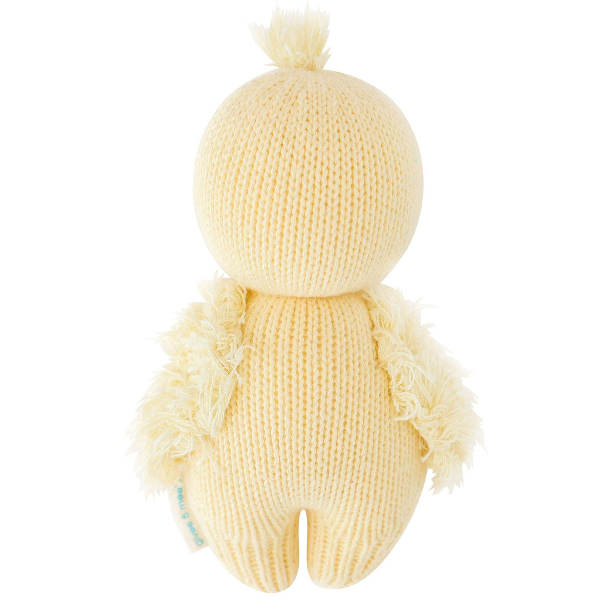 Knitted yellow plush toy with a fluffy texture on a white background
