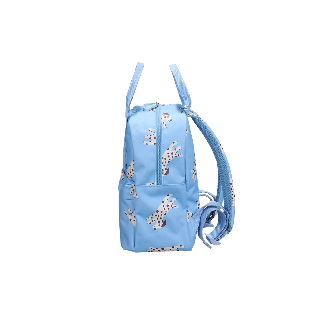 A light blue backpack featuring a playful print of Dalmatian dogs, with two top handles and a front zippered pocket, shown against a plain white background.