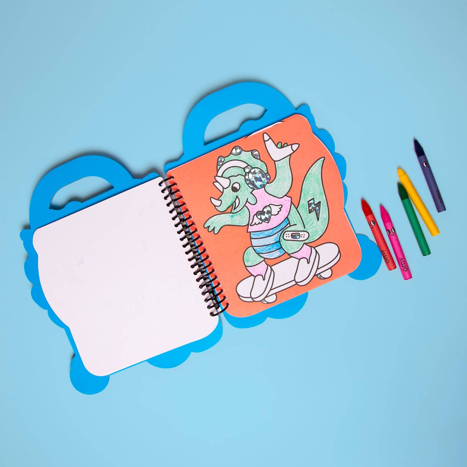 Colorful children's coloring book and crayon set with cartoon character packaging on a blue background
