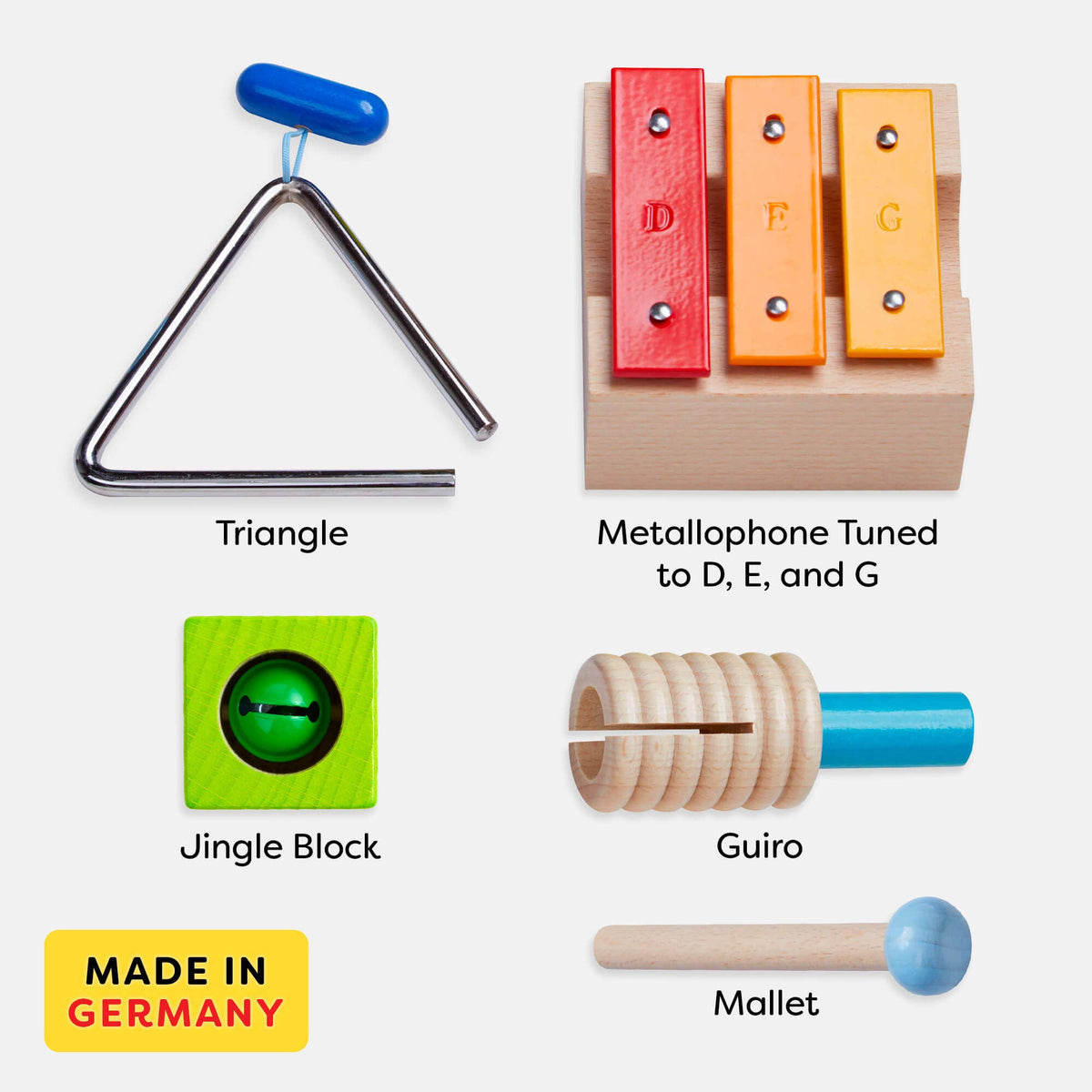 Set of musical instruments including a triangle, metallophone, jingle block, guiro, and mallet with &#39;Made in Germany&#39; label.
