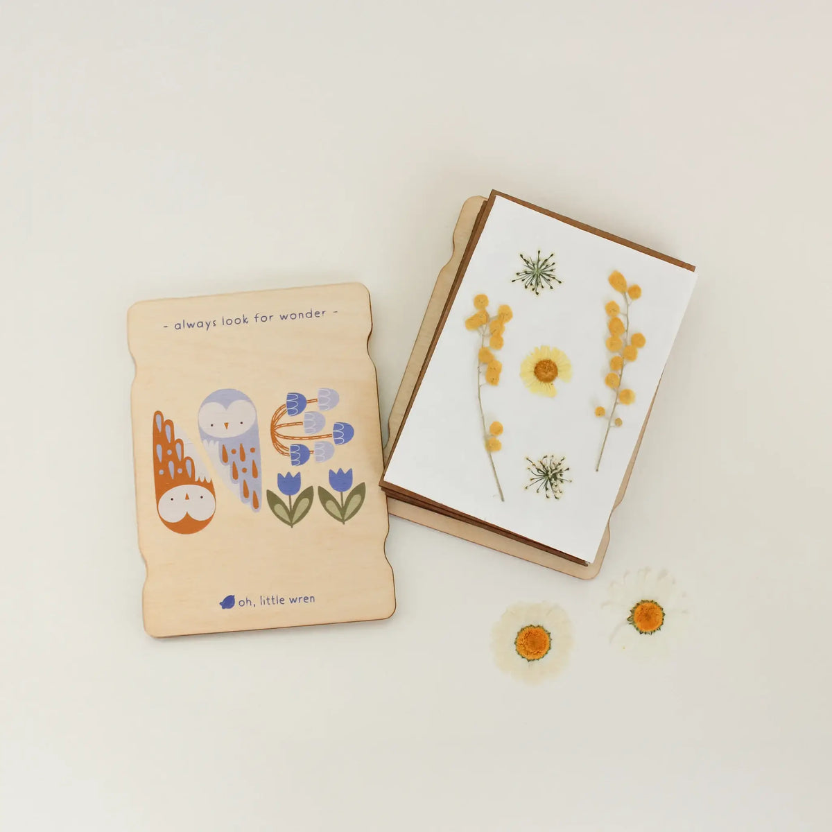 Flower press with floral designs on a light background