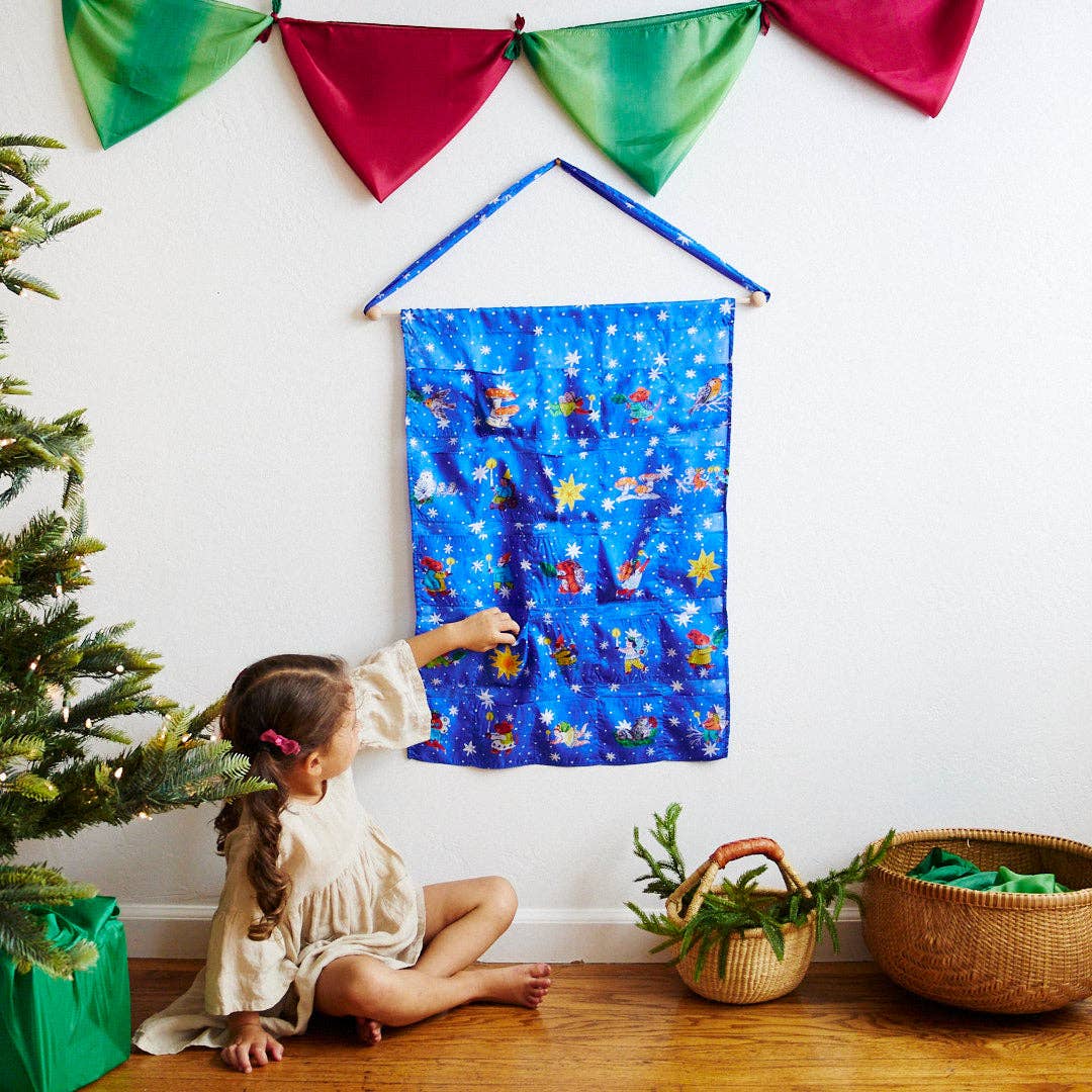 Children's advent calendar character pattern on a blue background