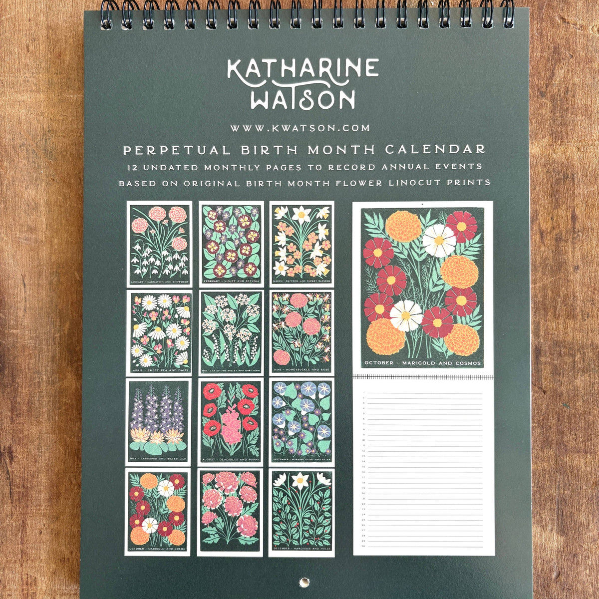 Perpetual birth month calendar by Katharine Watson on a wooden surface