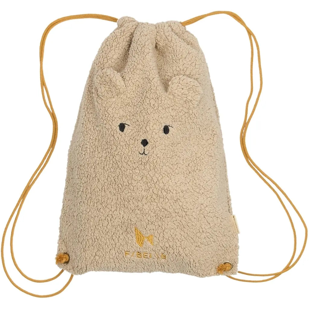 Beige drawstring bag with bear face design on a white background
