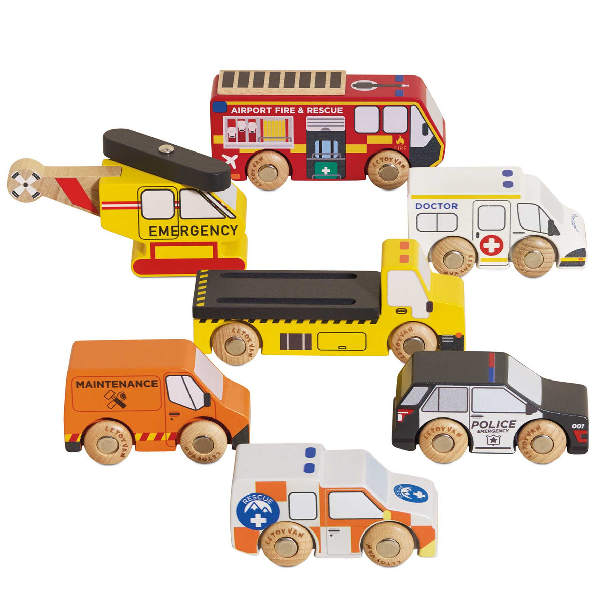 Set of wooden toy emergency vehicles including a helicopter, fire truck, ambulance, and police car on a white background.